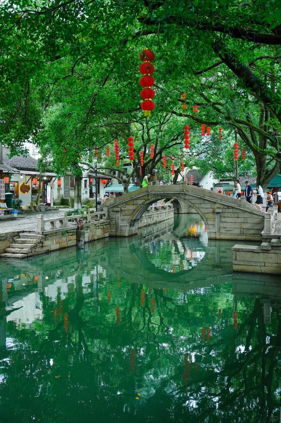 Tongli water-town bridge and canal reflections for a seven day Jiangnan rivers and gardens route